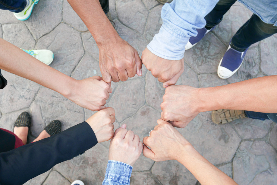 hand up of people working assemble corporate meeting show symbol Join forces teamwork quality and effective personnel Concept organizational development in teamwork and business